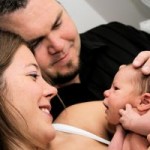 Mum and Dad holding newborn