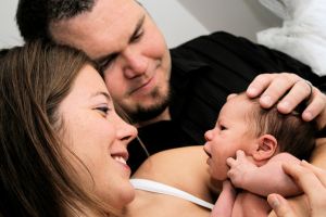 Mum and Dad holding newborn