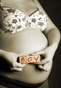 pregnant woman showing she's having a boy