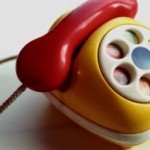 A yellow and red toy phone