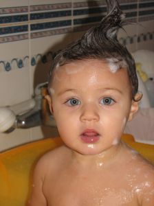 Baby bathing with lots of soap
